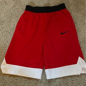 Red n White basketball shorts (boys sizing) can fit women’s small